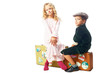 Photo: Kids sitting on a suitcases Kids sitting on a suitcases