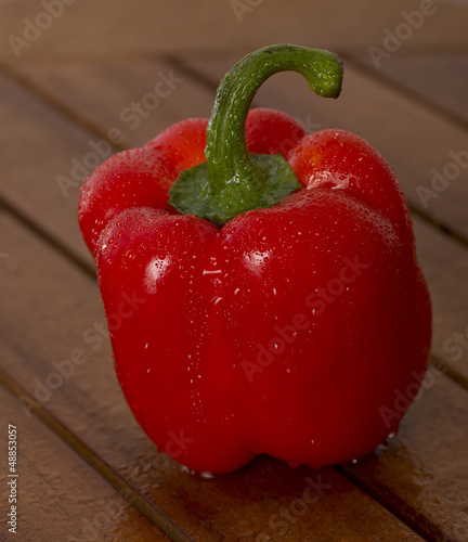 Photo: wet red paprika on the table wet red paprika on the table