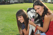 Photo: sisters and husky sisters and husky