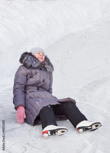 Photo: Woman has fallen on the ice rink Woman has fallen on the ice rink