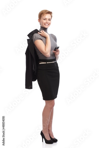 Photo: Smiling businesswoman holding mobile Smiling businesswoman holding mobile