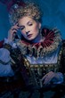 Pensive queen in royal dress
