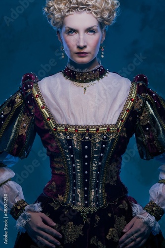 Photo: Haughty queen in royal dress Haughty queen in royal dress
