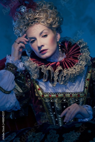 Photo: Pensive queen in royal dress Pensive queen in royal dress