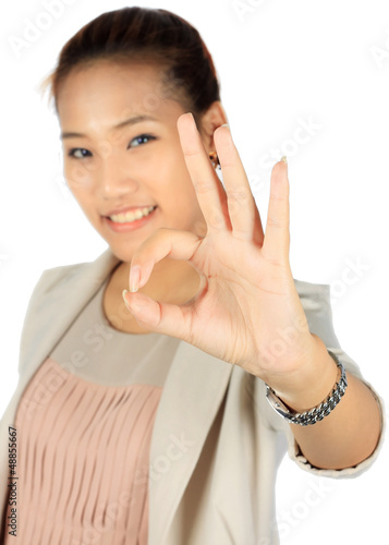 Photo: Isolated young business woman over white Isolated young business woman over white