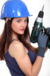 craftswoman holding electric drill