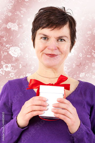 Photo: Woman with gift package Woman with gift package
