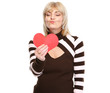 Photo: Happy mature woman enjoying heart shaped postcard Happy mature woman enjoying heart shaped postcard