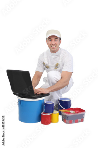 Photo: Decorator using the Internet Decorator using the Internet