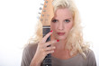 Woman holding an electric guitar