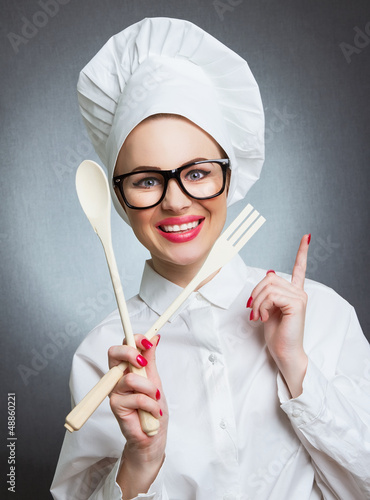 Photo: Portrait of happy young woman cook chef Portrait of happy young woman cook chef