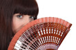 Woman holding hand fan