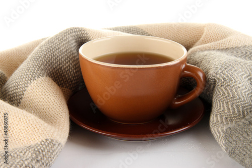Photo: cup of tea with scarf isolated on white cup of tea with scarf isolated on white