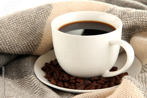 Photo: cup of coffee with scarf close-up cup of coffee with scarf close-up