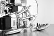 Stainless steel pots and untensils on table