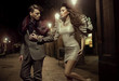 Photo: Fashionable couple at nightly walk Fashionable couple at nightly walk