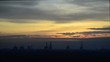 timelaspe of busy cranes against a sunrise