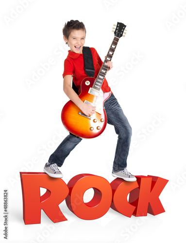 Photo: Boy plays on electric guitar with 3d text Boy plays on electric guitar with 3d text