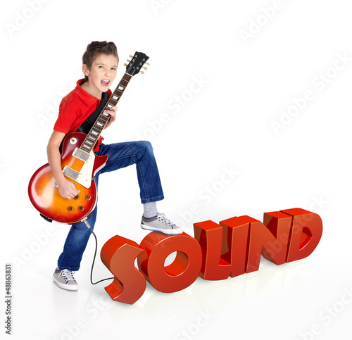 Photo: Boy plays on electric guitar with 3d text Boy plays on electric guitar with 3d text