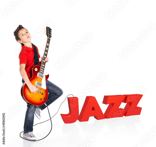 Photo: Boy plays on electric guitar with 3d text Boy plays on electric guitar with 3d text