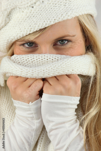 Photo: Girl covering her face with neck jersey Girl covering her face with neck jersey