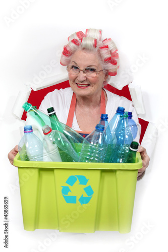 Photo: granny with hair curlers holding recycling tub granny with hair curlers holding recycling tub
