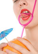 Woman's lips  with fruit and straw