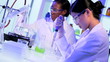 Female Pharmaceutical Researchers Modern Laboratory