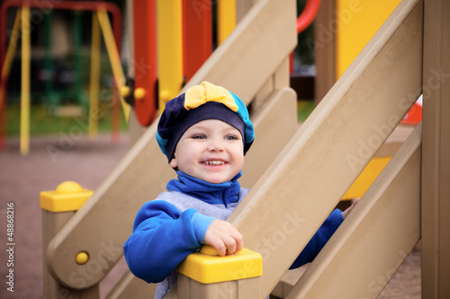 Photo: Boy Playing on Playground Boy Playing on Playground
