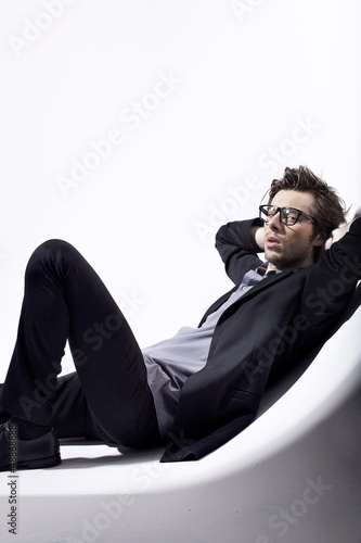 Photo: Very attractive young man relaxing in his place Very attractive young man relaxing in his place