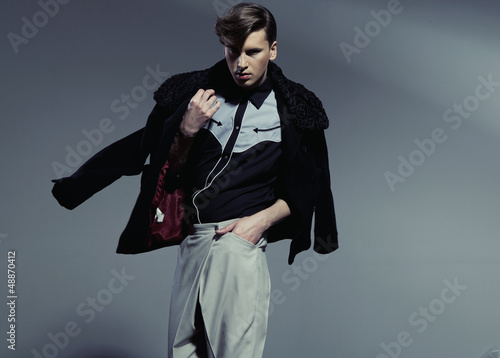 Photo: Young handsome man with unusual haircut Young handsome man with unusual haircut