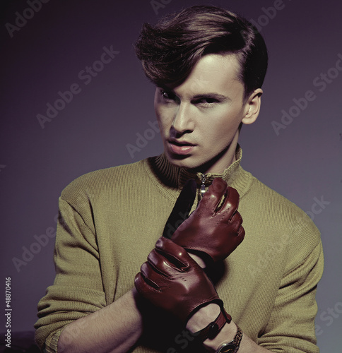 Photo: Fashion photo shot of a man wearing gloves Fashion photo shot of a man wearing gloves
