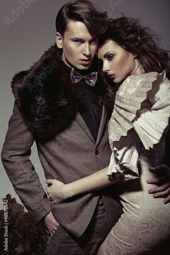 Photo: Young couple presenting an autumn fashion Young couple presenting an autumn fashion