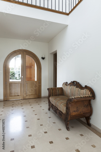 Photo: Interior, apartment, corridor with antique sofa Interior, apartment, corridor with antique sofa