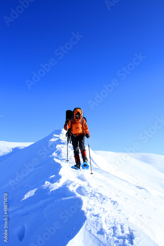 Photo: Winter hiking in snowshoes. Winter hiking in snowshoes.