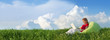 Spring panorama with woman sitting outdoors