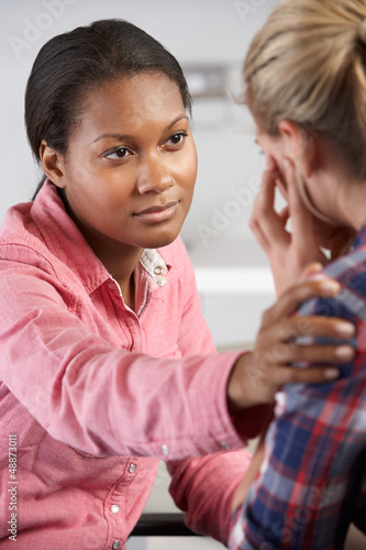 Photo: Teenage Girl Visits Doctor's Office Suffering With Depression Teenage Girl Visits Doctor's Office Suffering With Depression