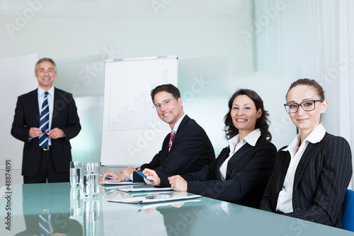 Photo: Business team holding a meeting Business team holding a meeting