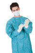 Surgeon putting on surgical gloves