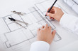 Architect working on blueprints