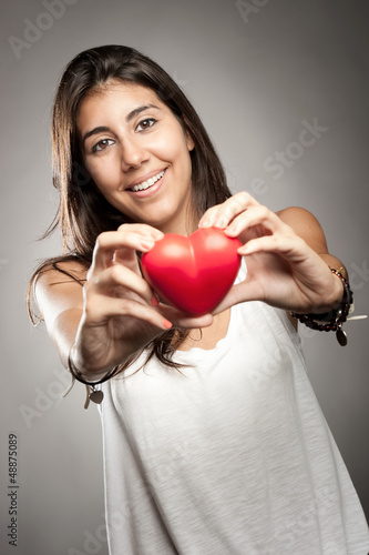 Photo: woman holding a heart woman holding a heart