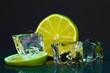 Ice cubes with lime on darck background