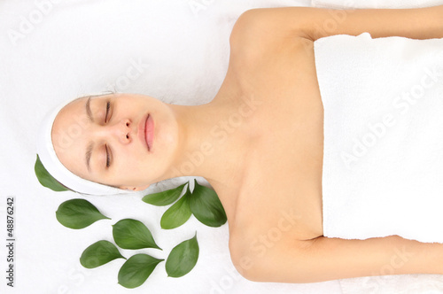 Photo: Young woman with creamy facial mask Young woman with creamy facial mask