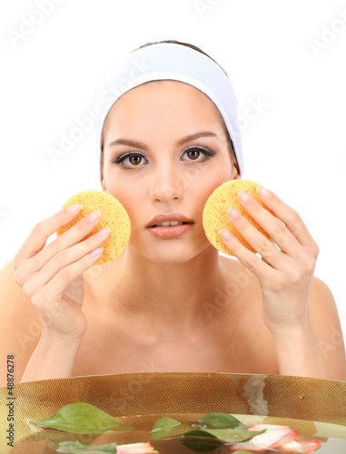 Photo: Young woman washing her face. Conceptual photo: make-up remover Young woman washing her face. Conceptual photo: make-up remover