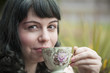 Young Woman with Antique Tea Cup