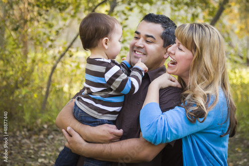 Photo: Happy Mixed Race Ethnic Family Playing In The Park Happy Mixed Race Ethnic Family Playing In The Park