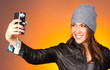 Hip Woman Snaps a Self Portrait with Vintage Camera
