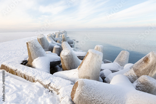 Photo: Pier concrete blocks covered with ice Pier concrete blocks covered with ice