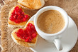 Photo: heart-shaped toast with jam and a cup of coffee heart-shaped toast with jam and a cup of coffee