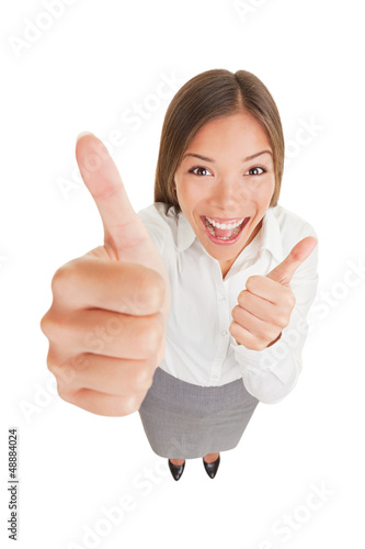 Photo: Happy excited woman giving thumbs up Happy excited woman giving thumbs up
